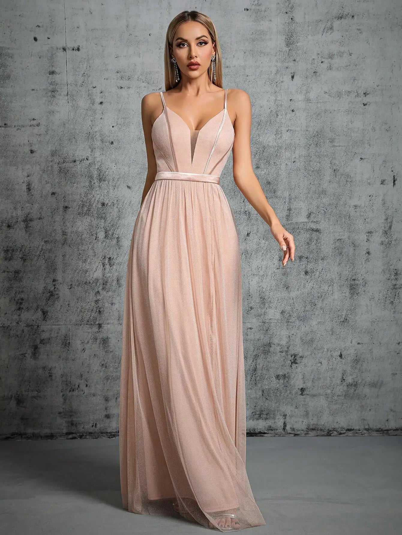 A deep V-bra design with a mesh slit long dress