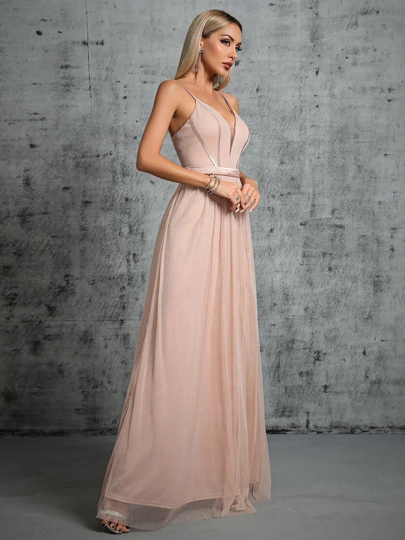 A deep V-bra design with a mesh slit long dress