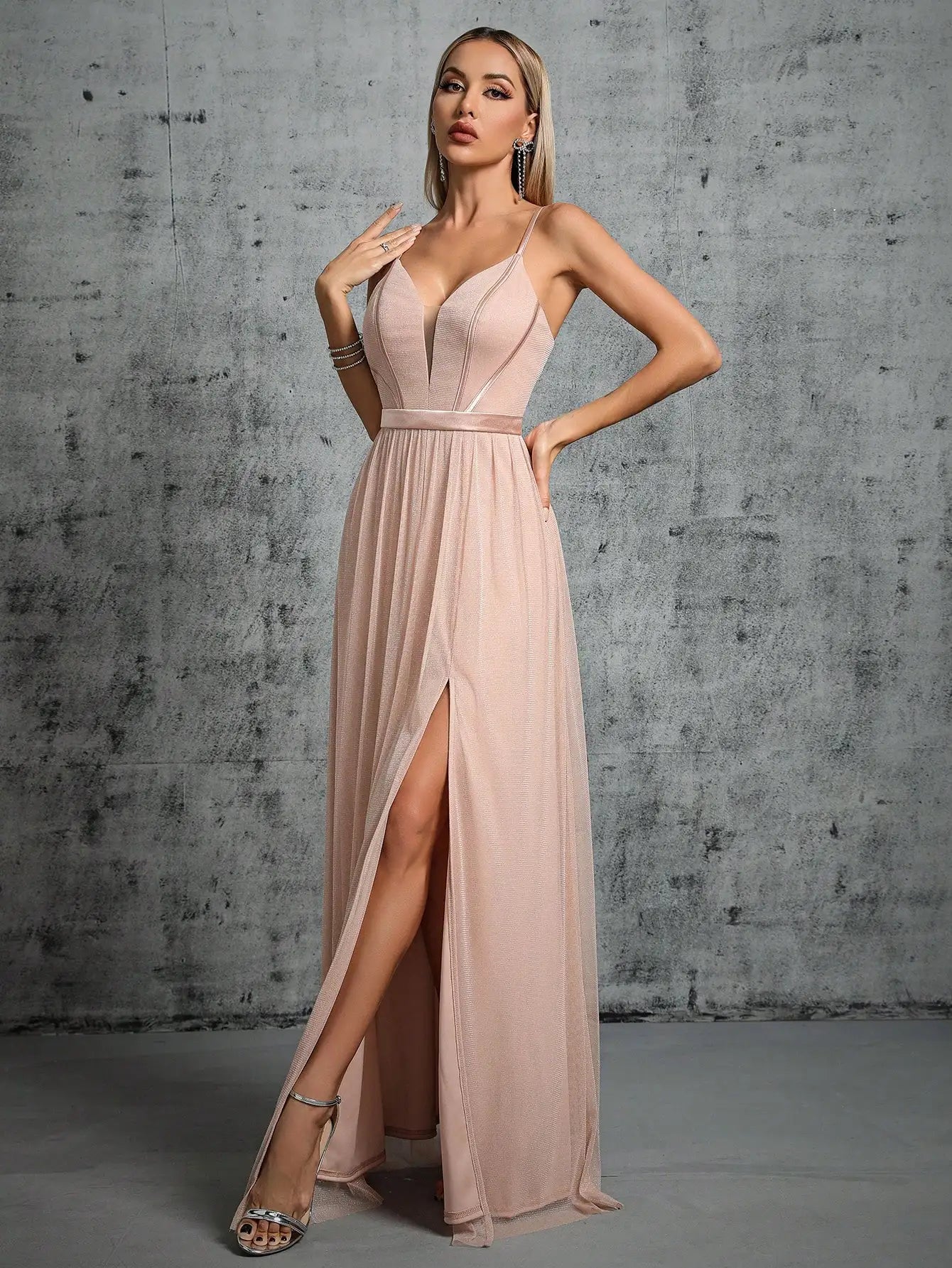 A deep V-bra design with a mesh slit long dress