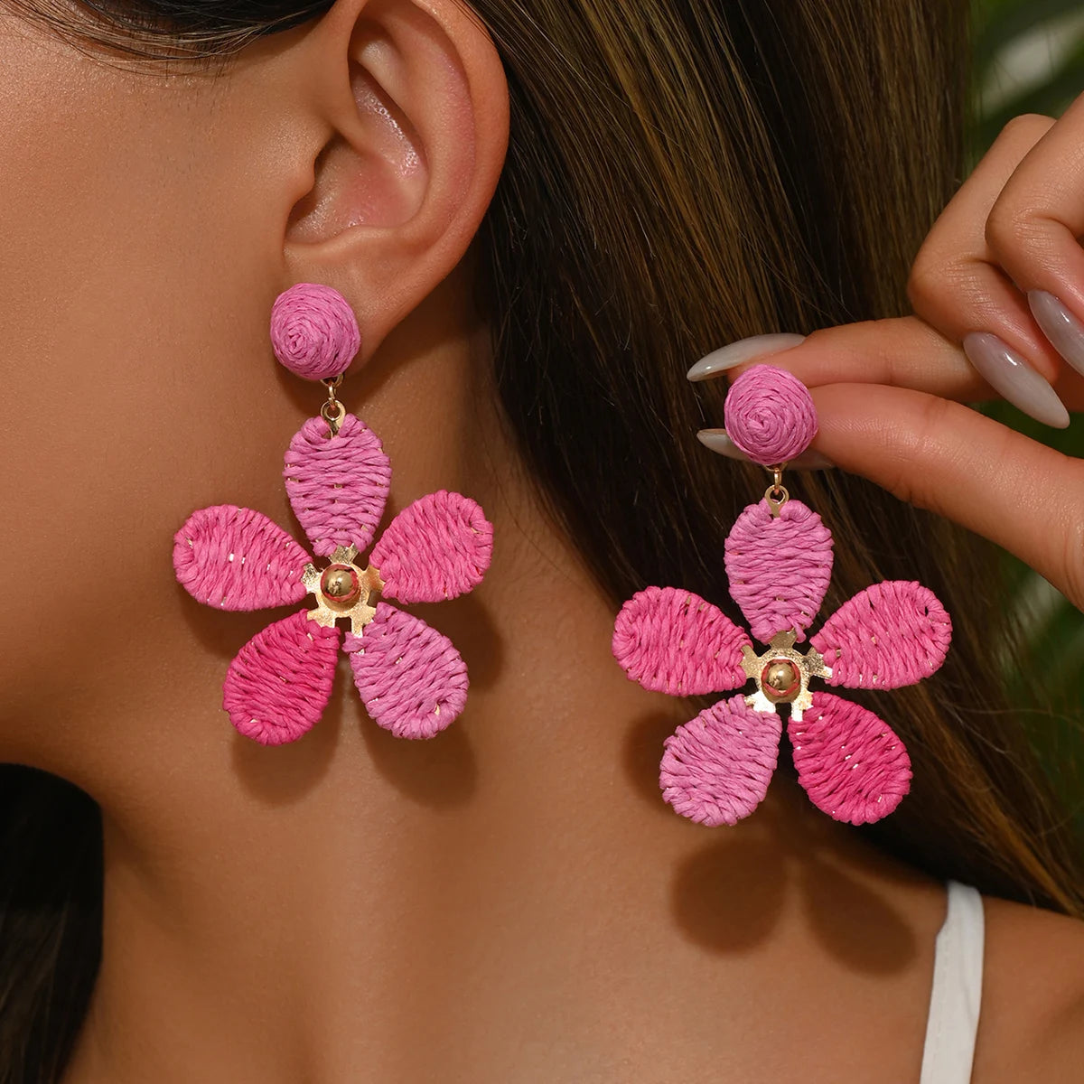 Bohemian-style hand-woven raffia flower earrings—a unique, minimalist design perfect for everyday wear.