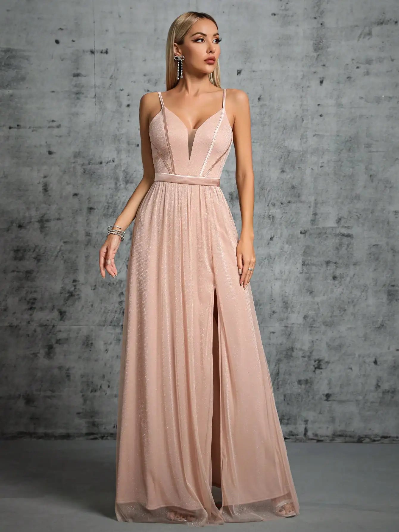 A deep V-bra design with a mesh slit long dress